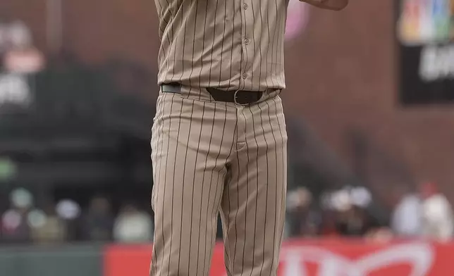 San Diego Padres' David Peralta gestures after hitting an RBI single against the San Francisco Giants during the 10th inning of a baseball game in San Francisco, Sunday, Sept. 15, 2024. (AP Photo/Jeff Chiu)