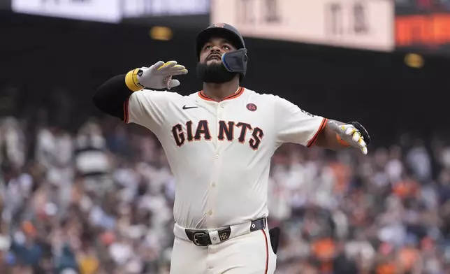 San Francisco Giants' Heliot Ramos celebrates after hitting a home run against the San Diego Padres during the ninth inning of a baseball game in San Francisco, Sunday, Sept. 15, 2024. (AP Photo/Jeff Chiu)