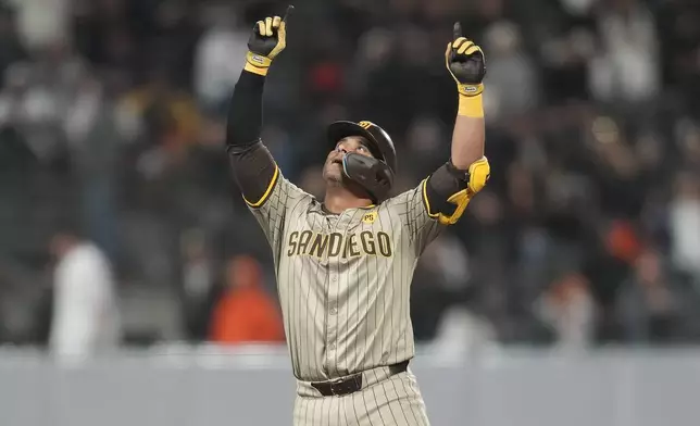 San Diego Padres' Donovan Solano gestures after hitting a double against the San Francisco Giants during the seventh inning of a baseball game in San Francisco, Saturday, Sept. 14, 2024. (AP Photo/Jeff Chiu)