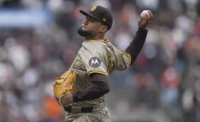 San Diego Padres pitcher Robert Suarez works against the San Francisco Giants during the ninth inning of a baseball game in San Francisco, Sunday, Sept. 15, 2024. (AP Photo/Jeff Chiu)