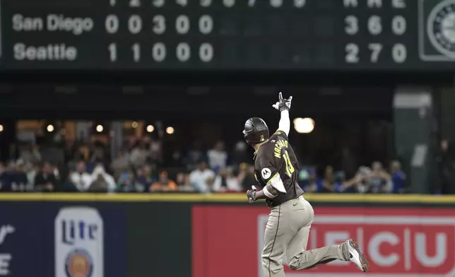 San Diego Padres' Manny Machado jogs the bases after hitting a two-run home run off Seattle Mariners starting pitcher George Kirby during the sixth inning of a baseball game, Tuesday, Sept. 10, 2024, in Seattle. (AP Photo/Jason Redmond)