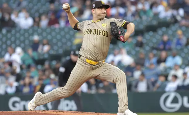 San Diego Padres starting pitcher Michael King throws during the first inning of a baseball game against the Seattle Mariners, Wednesday, Sept. 11, 2024, in Seattle. (AP Photo/Jason Redmond)