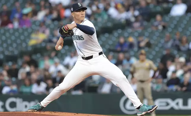 Seattle Mariners starting pitcher Bryan Woo throws during the first inning of a baseball game against the San Diego Padres, Wednesday, Sept. 11, 2024, in Seattle. (AP Photo/Jason Redmond)