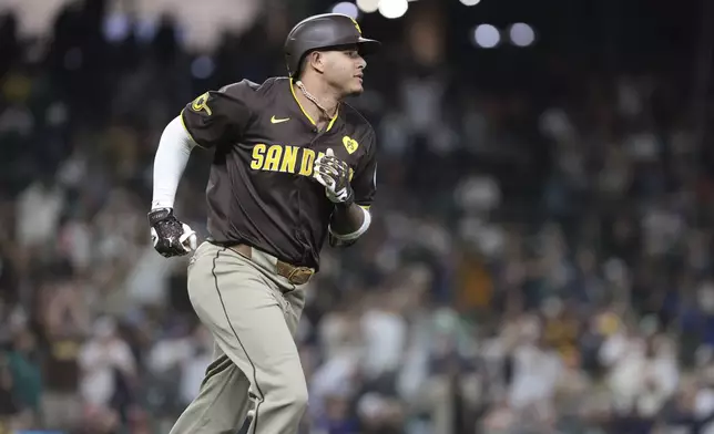 San Diego Padres' Manny Machado jogs the bases after hitting a two-run home run off Seattle Mariners starting pitcher George Kirby during the sixth inning of a baseball game, Tuesday, Sept. 10, 2024, in Seattle. (AP Photo/Jason Redmond)