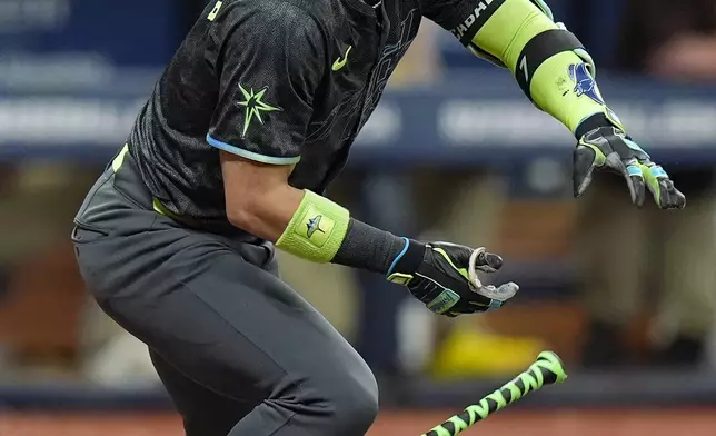 Tampa Bay Rays' Jose Caballero watches his two-run single off San Diego Padres starting pitcher Randy Vasquez during the fourth inning of a baseball game Saturday, Aug. 31, 2024, in St. Petersburg, Fla. (AP Photo/Chris O'Meara)