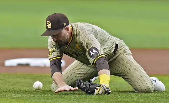 San Diego Padres shortstop Mason McCoy can't cleanly field an RBI single by Tampa Bay Rays' Jose Caballero during the first inning of a baseball game Saturday, Aug. 31, 2024, in St. Petersburg, Fla. (AP Photo/Chris O'Meara)