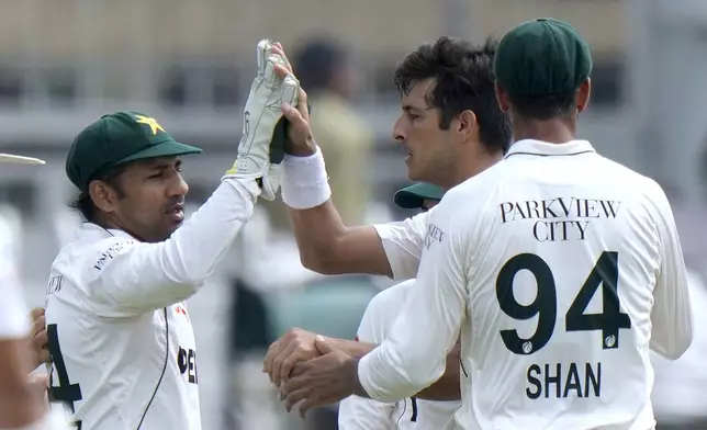 Pakistan's Mir Hamza, second right, celebrates with teammates after taking the wicket of Bangladesh's Zakir Hasan during the fifth day of second test cricket match between Pakistan and Bangladesh, in Rawalpindi, Pakistan, Tuesday, Sept. 3, 2024. (AP Photo/Anjum Naveed)