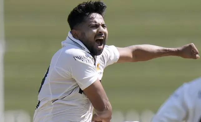 Pakistan's Khurram Shahzad celebrates after taking wickets of Bangladesh's Najmul Hossain Shanto during the third day of second test cricket match between Pakistan and Bangladesh, in Rawalpindi, Pakistan, Sunday, Sept. 1, 2024. (AP Photo/Anjum Naveed)