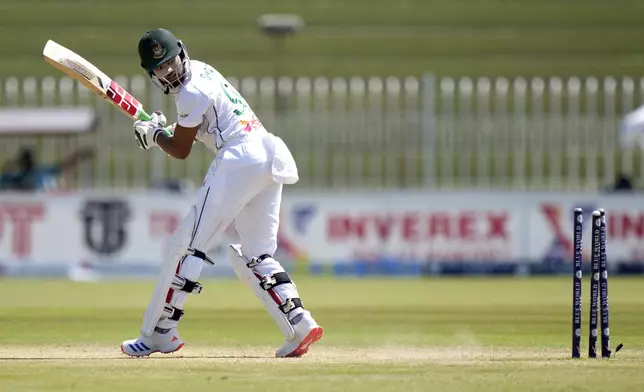 Bangladesh's Najmul Hossain Shanto looks wickets as he is bowled out by Pakistan's Khurram Shahzad during the third day of second test cricket match between Pakistan and Bangladesh, in Rawalpindi, Pakistan, Sunday, Sept. 1, 2024. (AP Photo/Anjum Naveed)