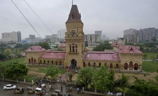 People visit the historical Empress Market in Karachi, Pakistan, Thursday, Aug. 29, 2024. (AP Photo/Fareed Khan)