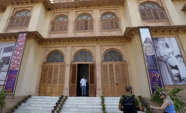 People visit at historical building "Mohatta Palace," which was built in 1920s and has since been turned into a museum, in Karachi, Pakistan, Friday, May 24, 2024. (AP Photo/Fareed Khan)