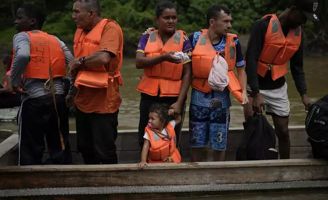 Migrants arrive by boat to Lajas Blancas, Panama, Thursday, Sept. 26, 2024, after their trek across the Darien Gap from Colombia in hopes of reaching the U.S. (AP Photo/Matias Delacroix)