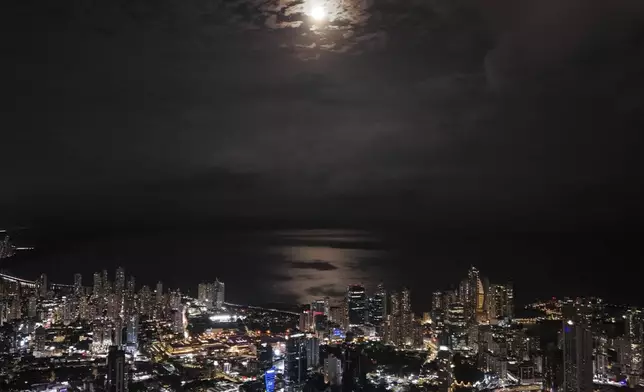 The supermoon rises above Panama City, Tuesday, Sept. 17, 2024. (AP Photo/Matias Delacroix)