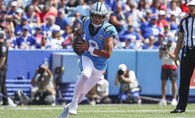 Carolina Panthers quarterback Bryce Young (9) scrambles in the first half of an NFL preseason football game against the Buffalo Bills, Saturday, Aug. 24, 2024, in Orchard Park, N.Y. (AP Photo/Jeffrey T. Barnes)