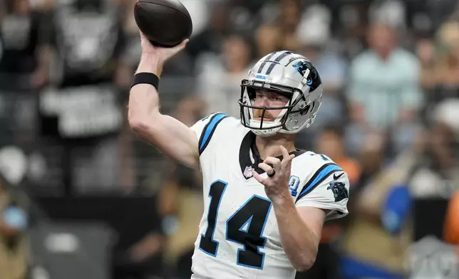 Carolina Panthers quarterback Andy Dalton passes against the Las Vegas Raiders during the first half of an NFL football game, Sunday, Sept. 22, 2024, in Las Vegas. (AP Photo/John Locher)