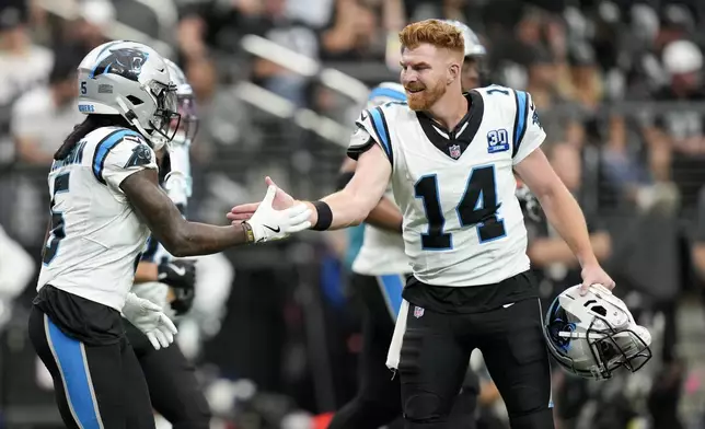 Carolina Panthers wide receiver Diontae Johnson celebrates after scoring with quarterback Andy Dalton during the first half of an NFL football game against the Las Vegas Raiders, Sunday, Sept. 22, 2024, in Las Vegas. (AP Photo/John Locher)