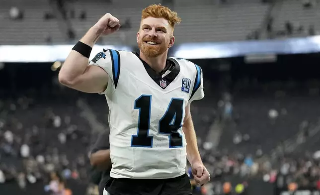 Carolina Panthers quarterback Andy Dalton celebrates after their win against the Las Vegas Raiders in an NFL football game, Sunday, Sept. 22, 2024, in Las Vegas. (AP Photo/John Locher)