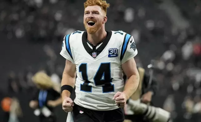 Carolina Panthers quarterback Andy Dalton celebrates after their win against the Las Vegas Raiders in an NFL football game, Sunday, Sept. 22, 2024, in Las Vegas. (AP Photo/John Locher)