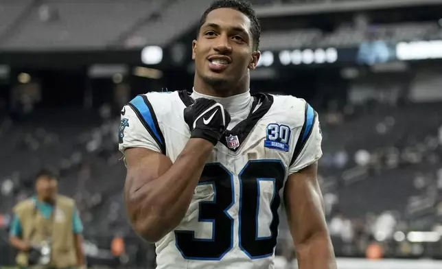 Carolina Panthers running back Chuba Hubbard celebrates after their win against the Las Vegas Raiders in an NFL football game, Sunday, Sept. 22, 2024, in Las Vegas. (AP Photo/John Locher)