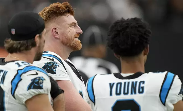 Carolina Panthers quarterback Andy Dalton smiles during the first half of an NFL football game against the Las Vegas Raiders, Sunday, Sept. 22, 2024, in Las Vegas. (AP Photo/John Locher)