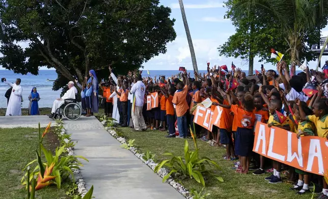 Pope Francis arrives at the Holy Trinity Humanistic School in Baro, near Vanimo, Papua New Guinea, Sunday, Sept. 8, 2024. Pope Francis celebrated the Catholic Church of the peripheries on Sunday as he traveled to the remote jungles of Papua New Guinea, bringing with him a ton of medicine and toys and a message of love overcoming violence for the people who live there.(AP Photo/Gregorio Borgia)