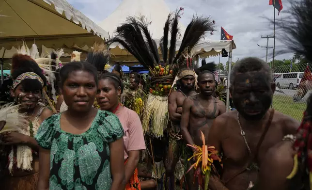 Papuan indigenous people wait for Pope Francis in Vanimo, Papua New Guinea, Sunday, Sept. 8, 2024. Pope Francis celebrated the Catholic Church of the peripheries on Sunday as he traveled to the remote jungles of Papua New Guinea, bringing with him a ton of medicine and toys and a message of love overcoming violence for the people who live there.(AP Photo/Gregorio Borgia)