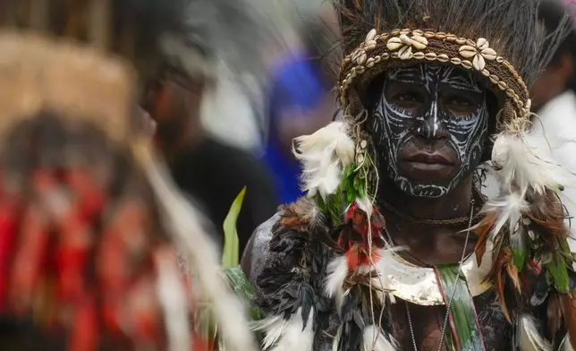 Faithful wait for Pope Francis to arrive at a meeting with faithful in Vanimo, Papua New Guinea, Sunday, Sept. 8, 2024. Pope Francis celebrated the Catholic Church of the peripheries on Sunday as he traveled to the remote jungles of Papua New Guinea, bringing with him a ton of medicine and toys and a message of love overcoming violence for the people who live there.(AP Photo/Gregorio Borgia)