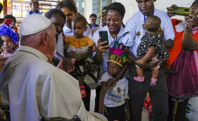 Pope Francis arrives at the Holy Trinity Humanistic School in Baro, near Vanimo, Papua New Guinea, Sunday, Sept. 8, 2024. Pope Francis celebrated the Catholic Church of the peripheries on Sunday as he traveled to the remote jungles of Papua New Guinea, bringing with him a ton of medicine and toys and a message of love overcoming violence for the people who live there.(AP Photo/Gregorio Borgia)