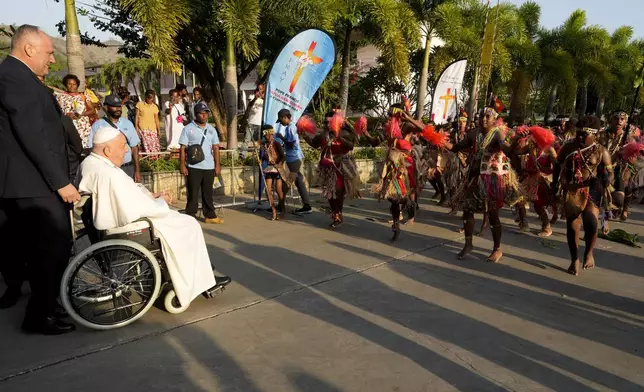 Traditional dancers welcome Pope Francis at Caritas Technical Secondary School in Port Moresby, Papua New Guinea, Saturday, Sept. 7, 2024. (AP Photo/Mark Baker)