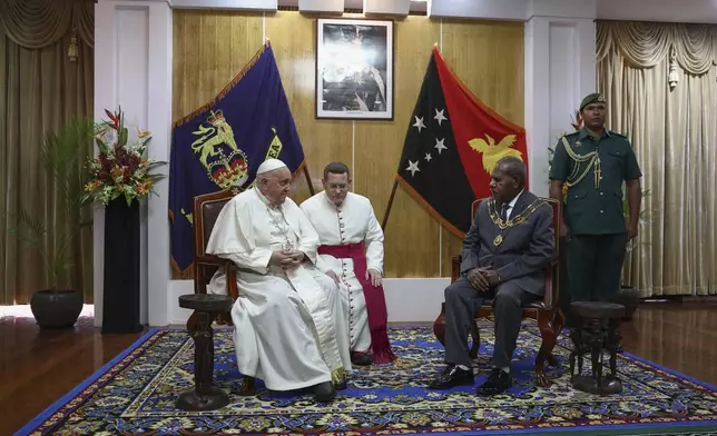 Pope Francis meets with the Papua New Guinea's Governor General Sir Bob Dadae at Government House in Port Moresby, Papua New Guinea, Saturday, Sept. 7, 2024. (Guglielmo Mangiapane/Pool Photo via AP)