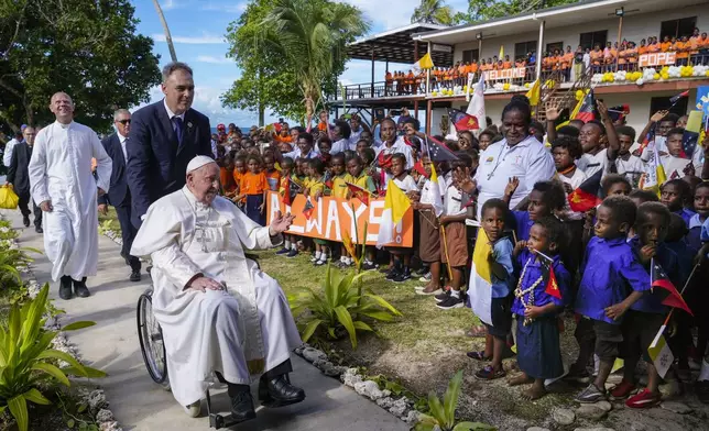 Pope Francis arrives at the Holy Trinity Humanistic School in Baro, near Vanimo, Papua New Guinea, Sunday, Sept. 8, 2024. Pope Francis celebrated the Catholic Church of the peripheries on Sunday as he traveled to the remote jungles of Papua New Guinea, bringing with him a ton of medicine and toys and a message of love overcoming violence for the people who live there.(AP Photo/Gregorio Borgia)