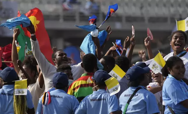 Faithful attend a meeting between Pope Francis and young people at the Sir John Guise stadium in Port Moresby, Monday, Sept. 9, 2024. (AP Photo/Gregorio Borgia)