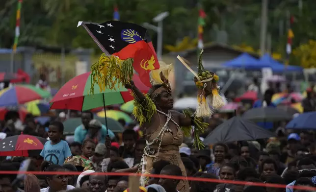 Faithful wait for Pope Francis to arrive at a meeting with faithful in Vanimo, Papua New Guinea, Sunday, Sept. 8, 2024. Pope Francis celebrated the Catholic Church of the peripheries on Sunday as he traveled to the remote jungles of Papua New Guinea, bringing with him a ton of medicine and toys and a message of love overcoming violence for the people who live there.(AP Photo/Gregorio Borgia)