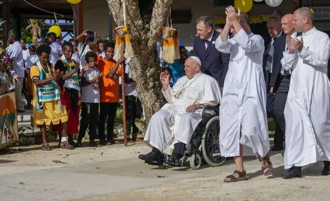 Pope Francis arrives at the Holy Trinity Humanistic School in Baro, near Vanimo, Papua New Guinea, Sunday, Sept. 8, 2024. Pope Francis celebrated the Catholic Church of the peripheries on Sunday as he traveled to the remote jungles of Papua New Guinea, bringing with him a ton of medicine and toys and a message of love overcoming violence for the people who live there.(AP Photo/Gregorio Borgia)