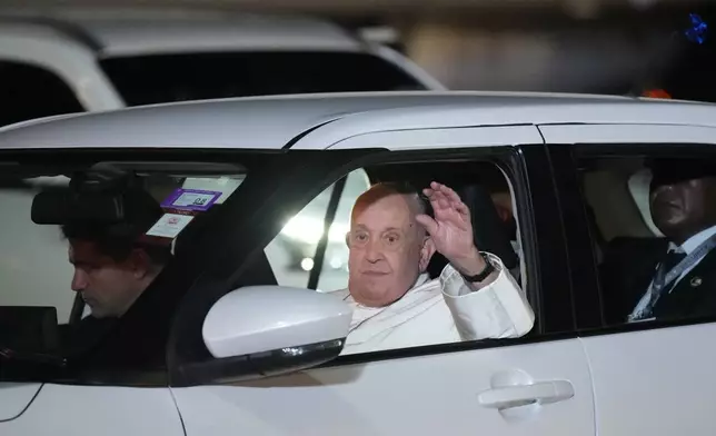 Pope Francis waves to the gathering as he leaves Jackson's International Airport in Port Moresby, Papua New Guinea, Friday, Sept. 6, 2024. (AP Photo/Mark Baker)