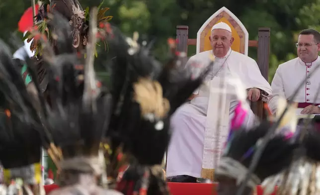 Pope Francis meets with faithful in Vanimo, Papua New Guinea, Sunday, Sept. 8, 2024. Pope Francis celebrated the Catholic Church of the peripheries on Sunday as he traveled to the remote jungles of Papua New Guinea, bringing with him a ton of medicine and toys and a message of love overcoming violence for the people who live there.(AP Photo/Gregorio Borgia)