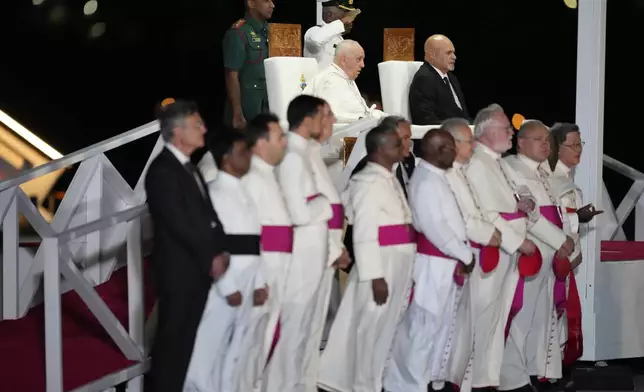 Pope Francis and Papua New Guinea's Deputy Prime Minister John Rosso sit for a welcome of the Pope upon arrival at Jackson's International Airport in Port Moresby, Papua New Guinea, Friday, Sept. 6, 2024. (AP Photo/Mark Baker)