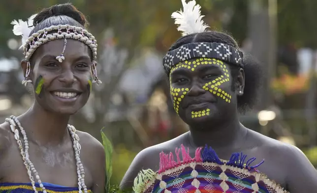 Young Papua New Guineans are dressed in traditional attire during a visit by Pope Francis at Caritas Technical Secondary School in Port Moresby, Papua New Guinea, Saturday, Sept. 7, 2024. (AP Photo/Mark Baker)