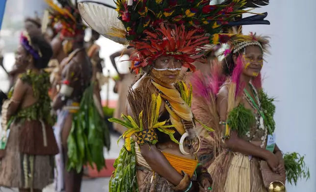 A traditional dancer waits for the arrival of Pope Francis at APEC Haus in Port Moresby, Papua New Guinea, Saturday, Sept. 7, 2024. (AP Photo/Mark Baker)