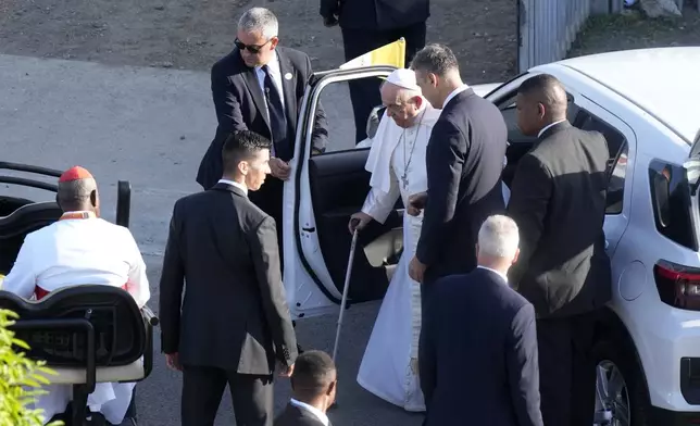 Pope Francis, center, arrives to perform a holly mass at Sir John Guise Stadium in Port Moresby, Papua New Guinea, Sunday, Sept. 8, 2024. (AP Photo/Mark Baker)