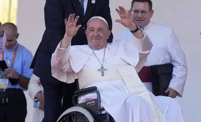 Pope Francis waves after giving an address during meeting with young people in the Sir John Guise Stadium in Port Moresby, Papua New Guinea, Monday, Sept. 9, 2024. (AP Photo/Mark Baker)