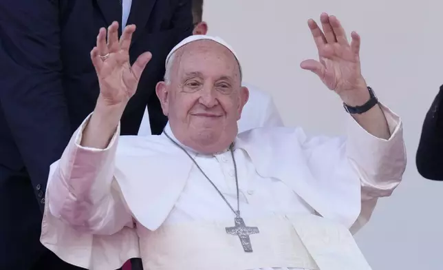 Pope Francis waves after giving an address during meeting with young people in the Sir John Guise Stadium in Port Moresby, Papua New Guinea, Monday, Sept. 9, 2024. (AP Photo/Mark Baker)