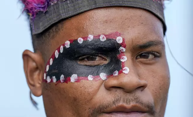 A traditional dancer waits for the arrival of Pope Francis at APEC Haus in Port Moresby, Papua New Guinea, Saturday, Sept. 7, 2024. (AP Photo/Mark Baker)