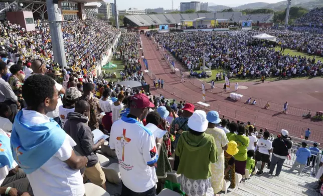 Thousands of people gather as Pope Francis holds a holly mass at Sir John Guise Stadium in Port Moresby, Papua New Guinea, Sunday, Sept. 8, 2024. (AP Photo/Mark Baker)