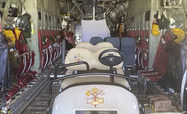 The golf cart used by Pope Francis during his visit to Vanimo, Papua New Guinea, Sunday, Sept. 8, 2024, is seen loaded inside the Royal Australian Air Force Hercules C 130Js plane that brought him from Port Moresby to Vanimo on Sunday. (AIGAV Pool via AP)