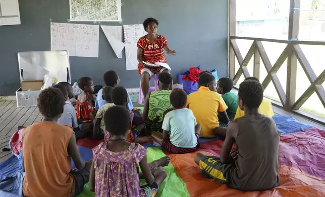 In this undated photo provided by UNICEF PNG, East Sepik massacre survivors participate in a class in a care center in Angoram, Papua New Guinea. (Noreen Chambers/UNICEF PNG via AP)