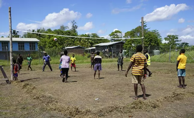 In this undated photo provided by UNICEF PNG, East Sepik massacre survivors play volleyball at a care center in Angoram, Papua New Guinea. (Noreen Chambers/UNICEF PNG via AP)