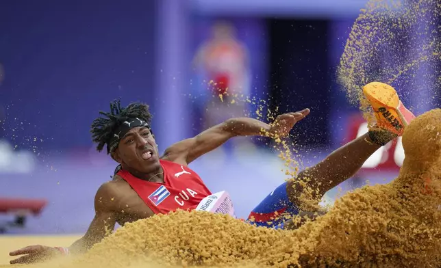 Cuba's Robiel Yankiel Sol Cervantes competes at the men's long jump T47 during the 2024 Paralympics, Tuesday, Sept. 3, 2024, in Paris, France. (AP Photo/Thibault Camus)