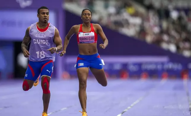 Cuba's Omara Durand Elias competes in the women's 400 m. T12 during the 2024 Paralympics, Tuesday, Sept. 3, 2024, in Paris, France. (AP Photo/Thibault Camus)