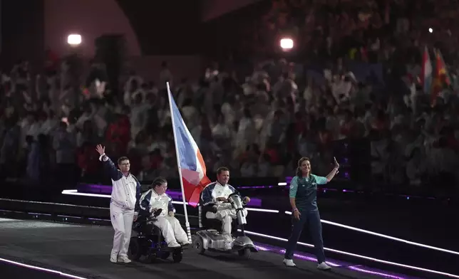 Members of the French delegation parade during the closing ceremony of the 2024 Paralympics, Sunday, Sept. 8, 2024, in Paris, France. (AP Photo/Thibault Camus)